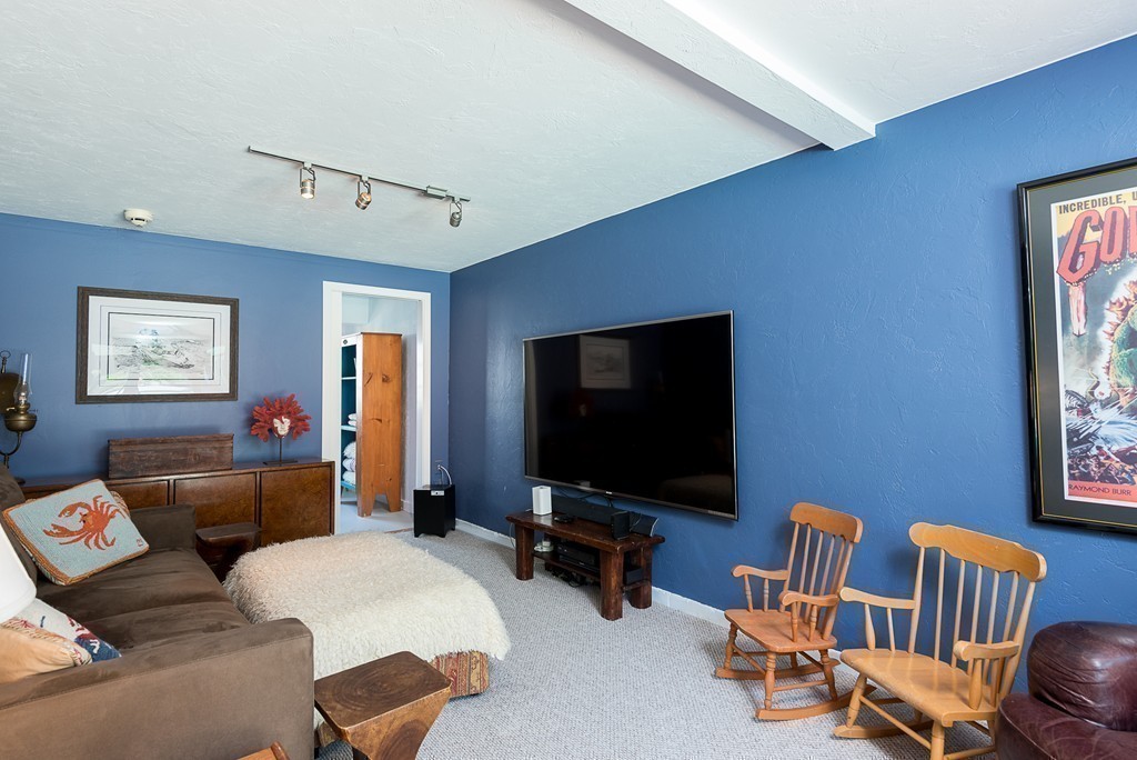 31 High Street Hingham, MA 02043 - Photo 11 of 29 a living room with furniture and a flat screen tv