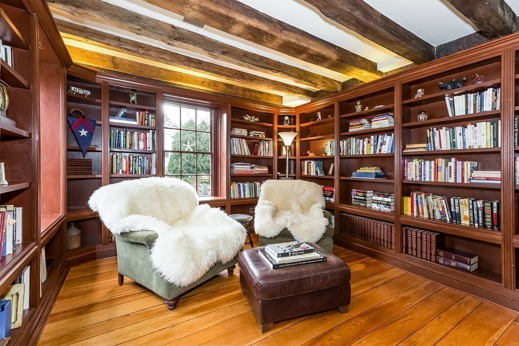 31 High Street Hingham, MA 02043 - Photo 12 of 29 a living room with furniture and a book shelf