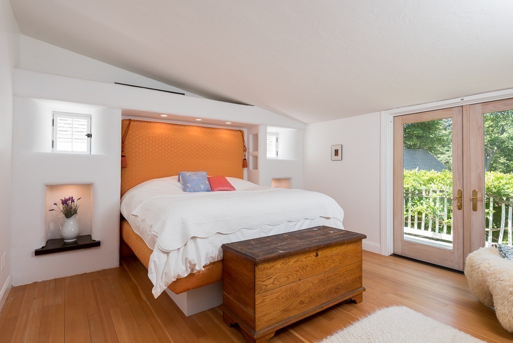 31 High Street Hingham, MA 02043 - Photo 13 of 29 a bed sitting in a bedroom next to a window