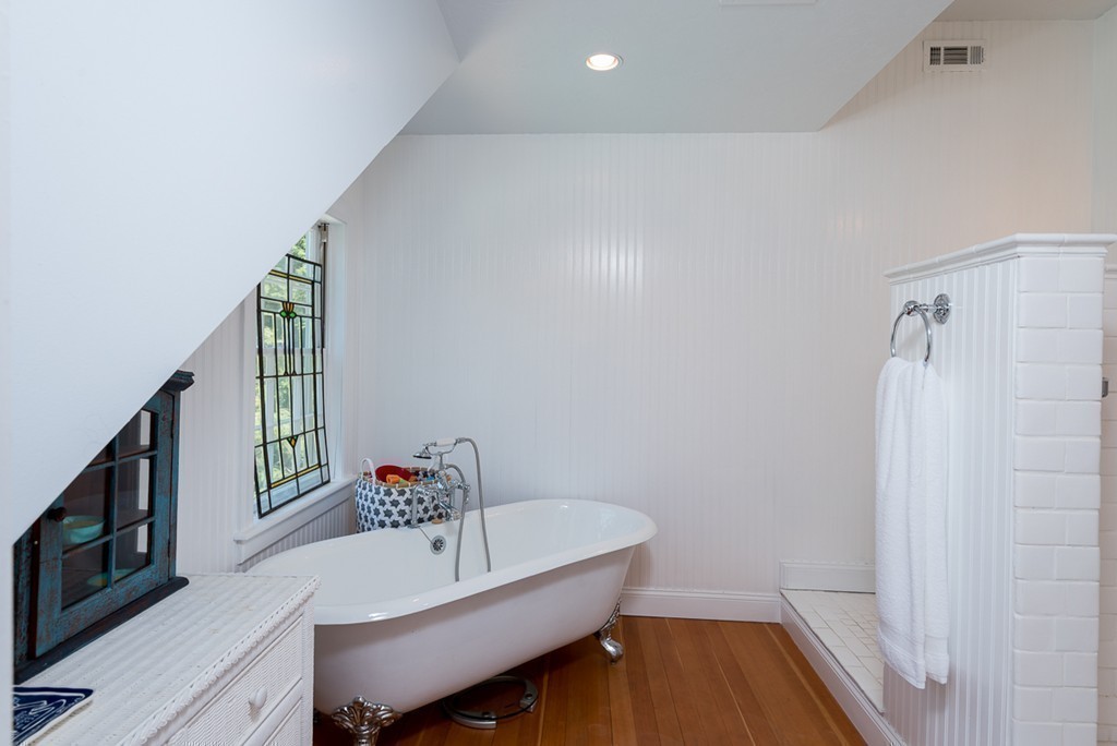 31 High Street Hingham, MA 02043 - Photo 16 of 29 a bathroom with a sink and a bathtub