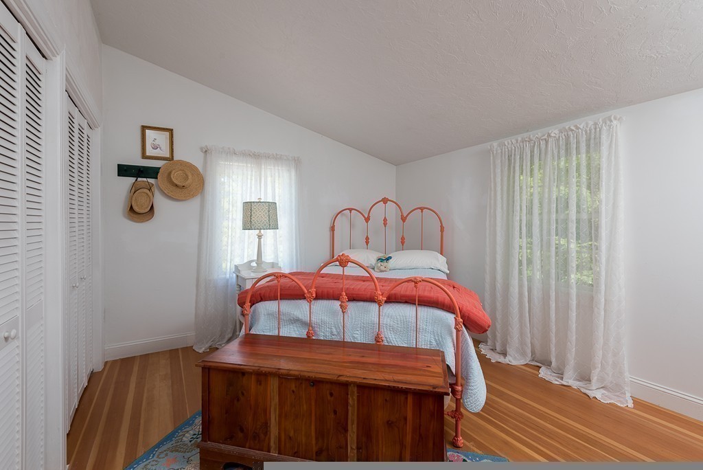 31 High Street Hingham, MA 02043 - Photo 19 of 29 a bedroom with a bed and window
