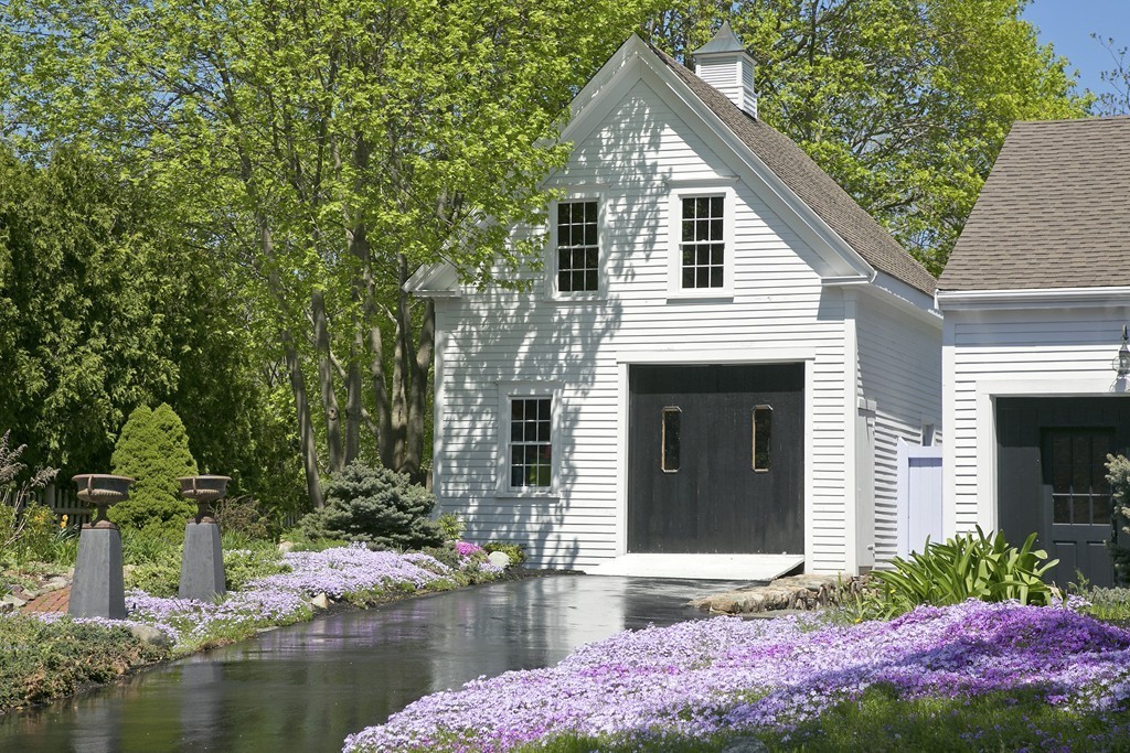 31 High Street Hingham, MA 02043 - Photo 28 of 29 a front view of a house with a yard