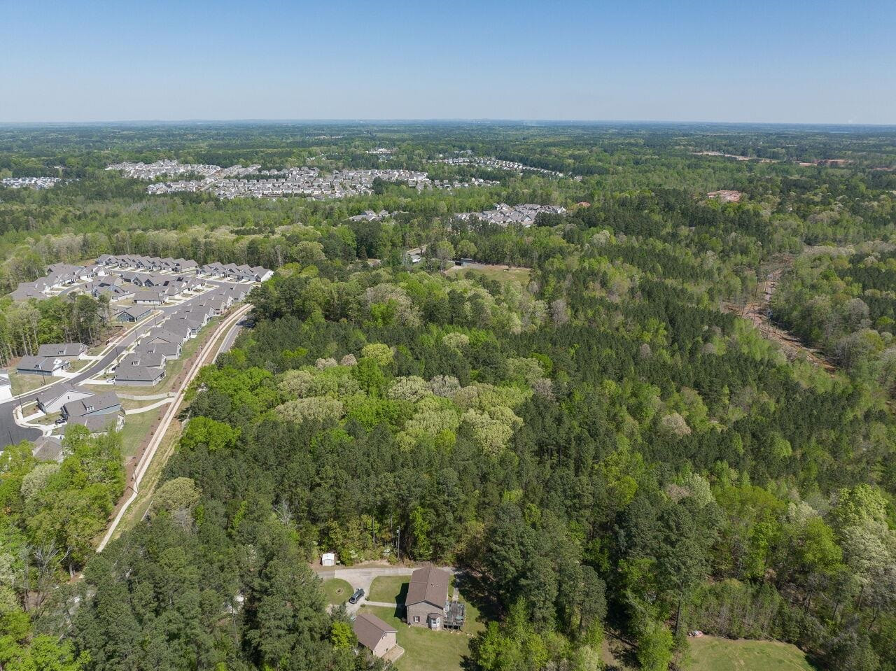 1301 Doc Nichols Road Durham, NC 27703 - Photo 7 of 9 an aerial view of residential houses with outdoor space and trees