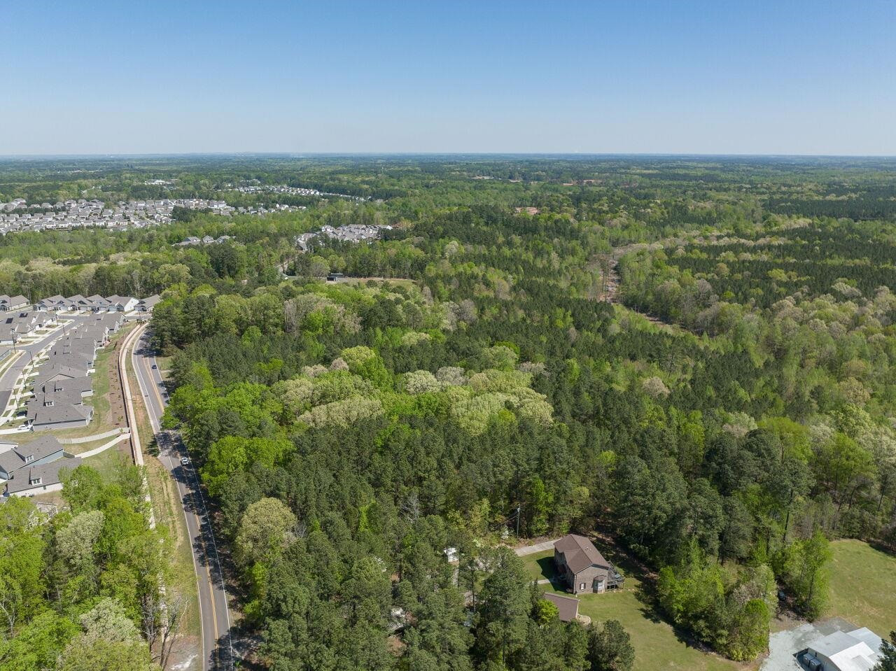 1301 Doc Nichols Road Durham, NC 27703 - Photo 8 of 9 an aerial view of residential houses with outdoor space and trees