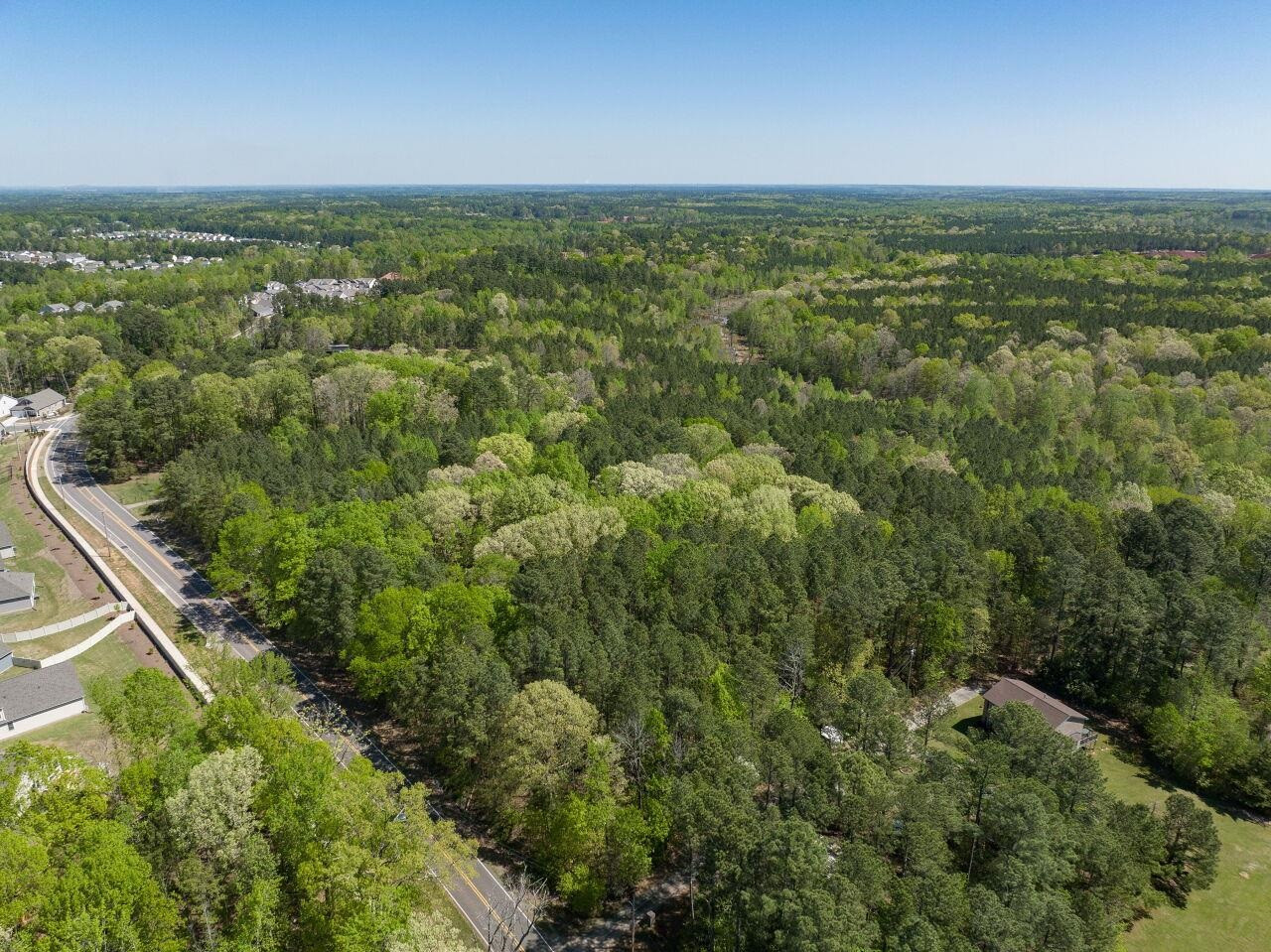 1301 Doc Nichols Road Durham, NC 27703 - Photo 9 of 9 an aerial view of residential houses with outdoor space and trees