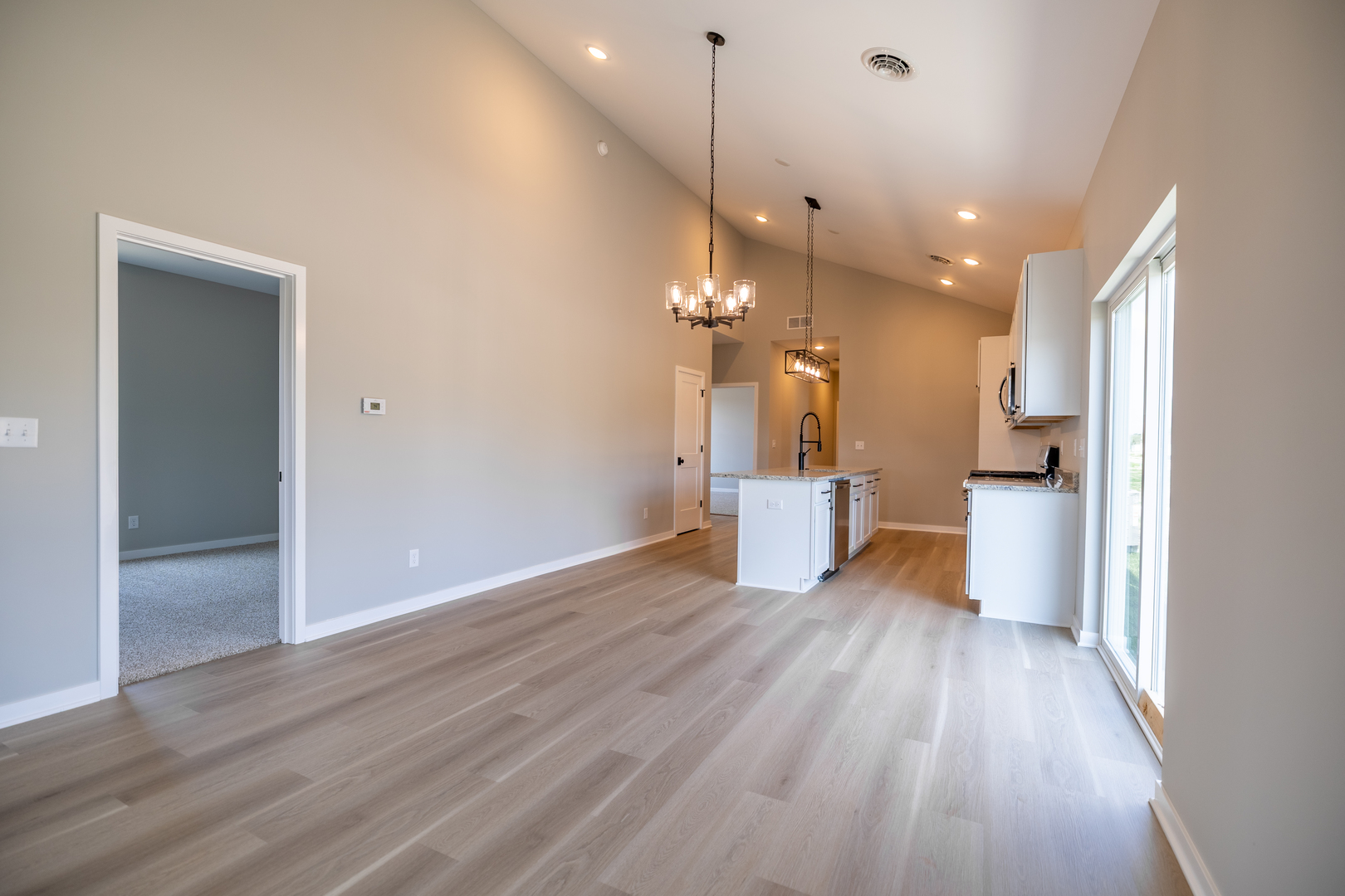 12 Redbud Row Ottawa, IL 61350 - Photo 14 of 39 a view of a kitchen with wooden floor and a large window
