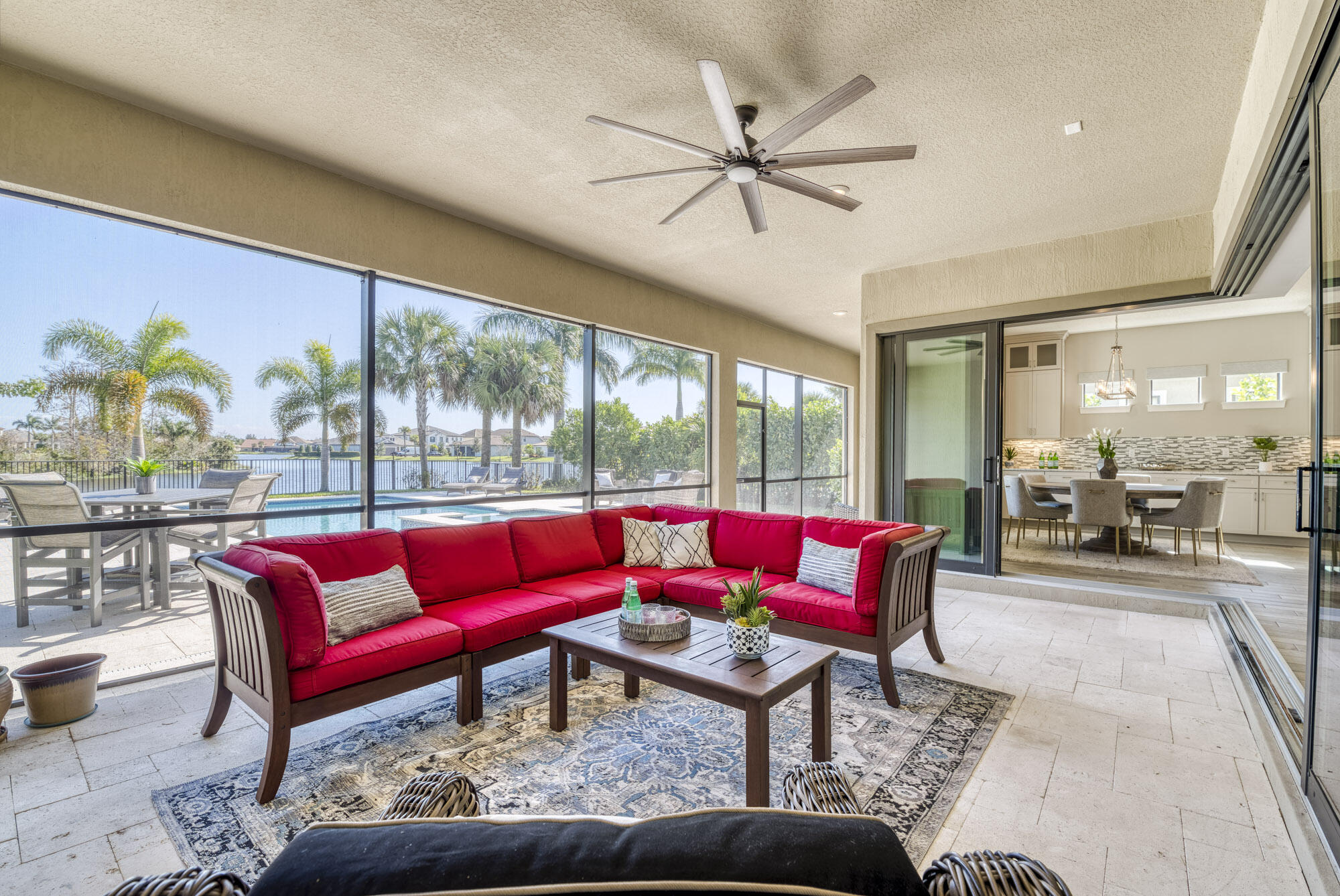 117 Croft Inlet Point Jupiter, FL 33478 - Photo 22 of 53 a living room with furniture and a floor to ceiling window