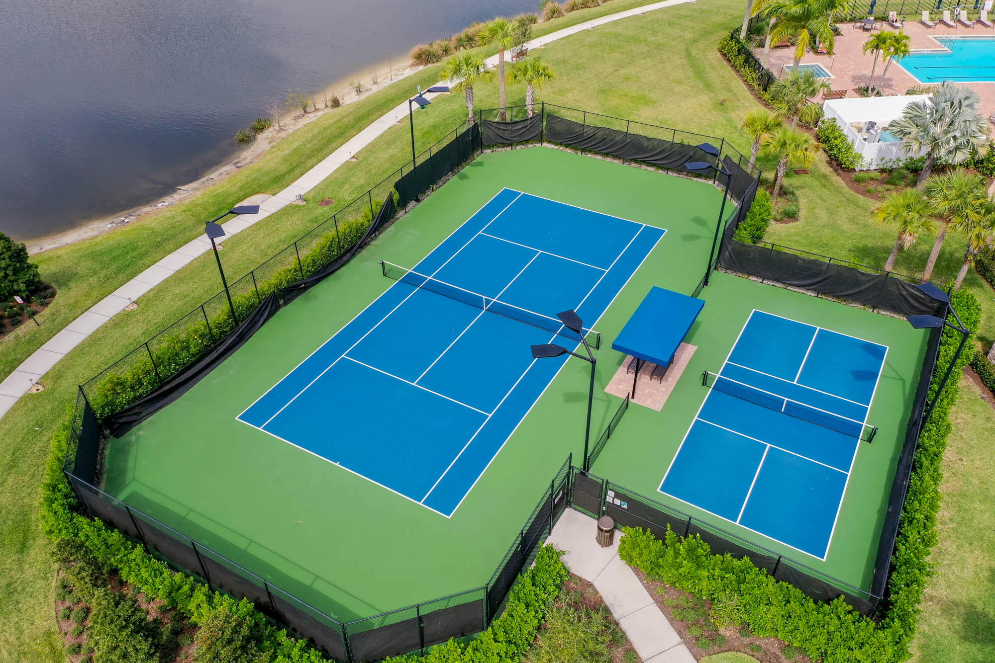 117 Croft Inlet Point Jupiter, FL 33478 - Photo 49 of 53 a green field with trees in the background