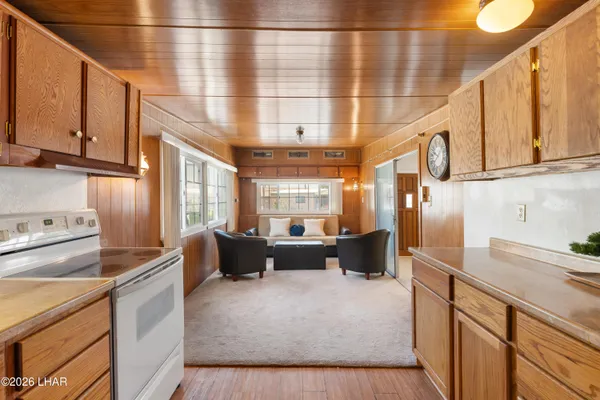 a kitchen with stainless steel appliances kitchen island granite countertop a sink and cabinets