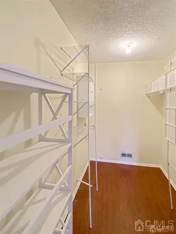 a view of walk in closet with window