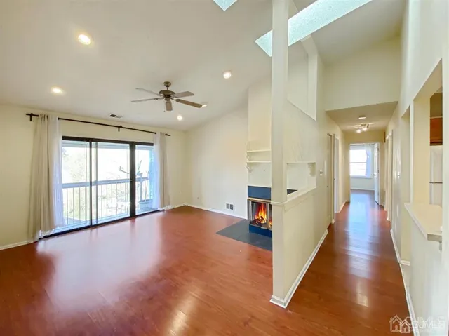 a view of an entryway with wooden floor