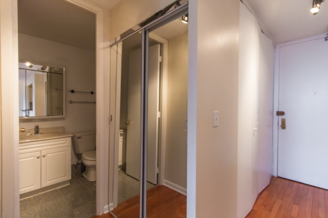444 West Fullerton Parkway, Unit 1510 Chicago, IL 60614 - Photo 8 of 8 a bathroom with a granite countertop sink toilet and shower
