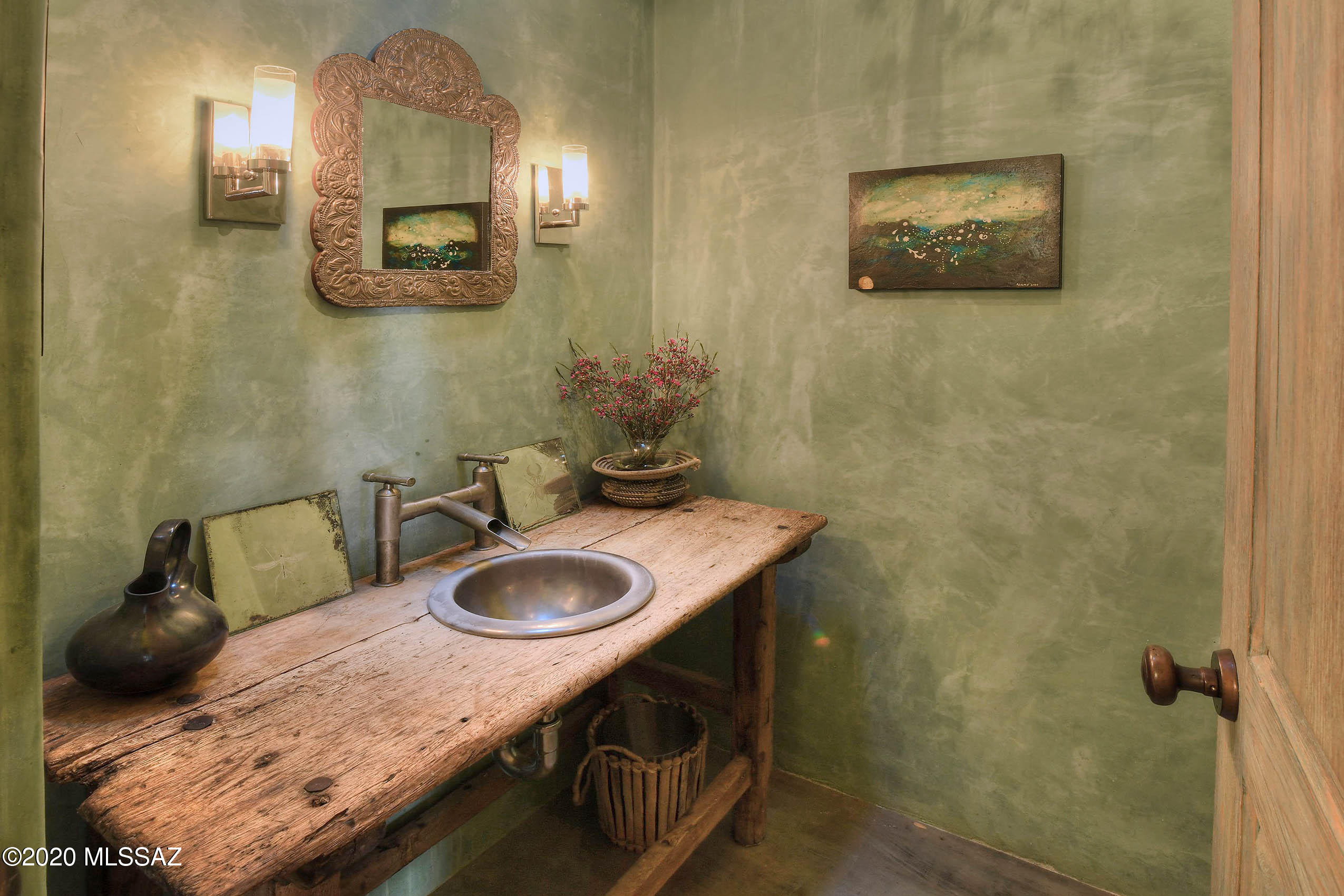 360 Harshaw Creek Road Patagonia, AZ 85624 - Photo 24 of 50 a bathroom with a granite countertop sink and a mirror