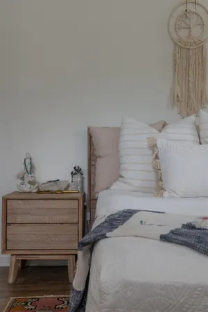 a bedroom with a bed and a dresser