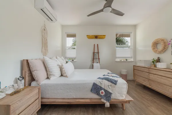 a bedroom with a bed and a chandelier