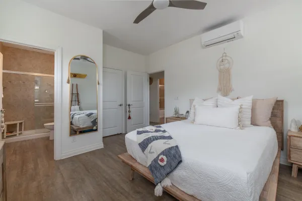 a bedroom with a bed and a view of bedroom