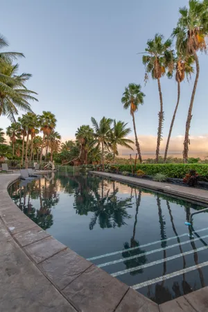 a view of swimming pool from a balcony