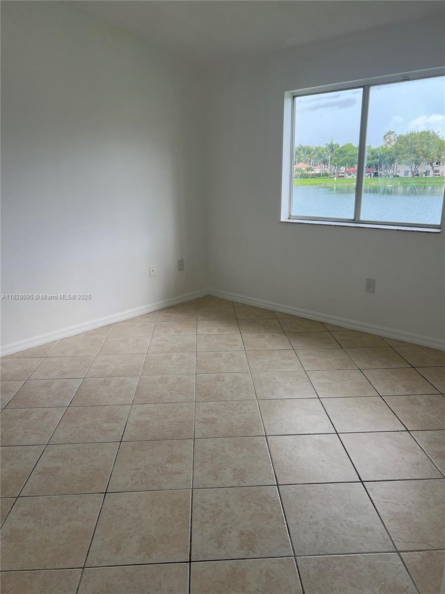 2921 Southeast 12th Road, Unit 20656 Homestead, FL 33035 - Photo 7 of 9 a view of an empty room with a window