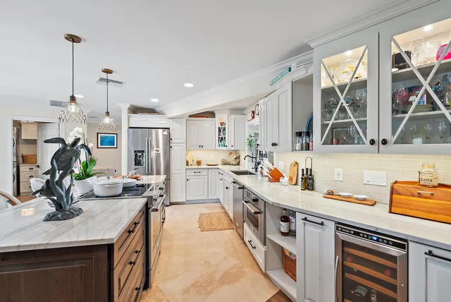a kitchen with sink and a window