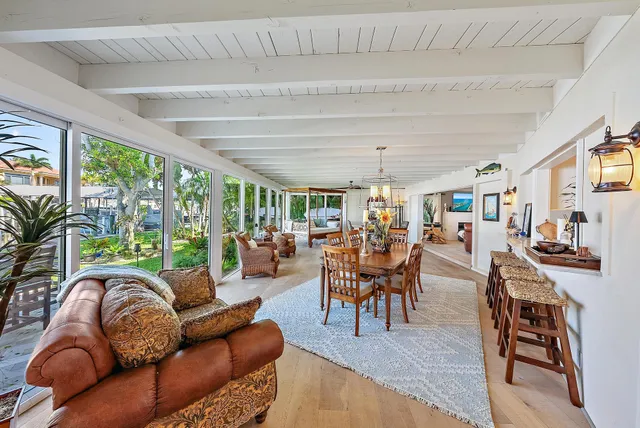 a bedroom with a large bed a couch and dresser