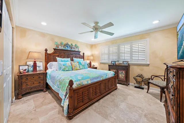 a bathroom with a granite countertop sink a toilet a mirror and a glass door shower