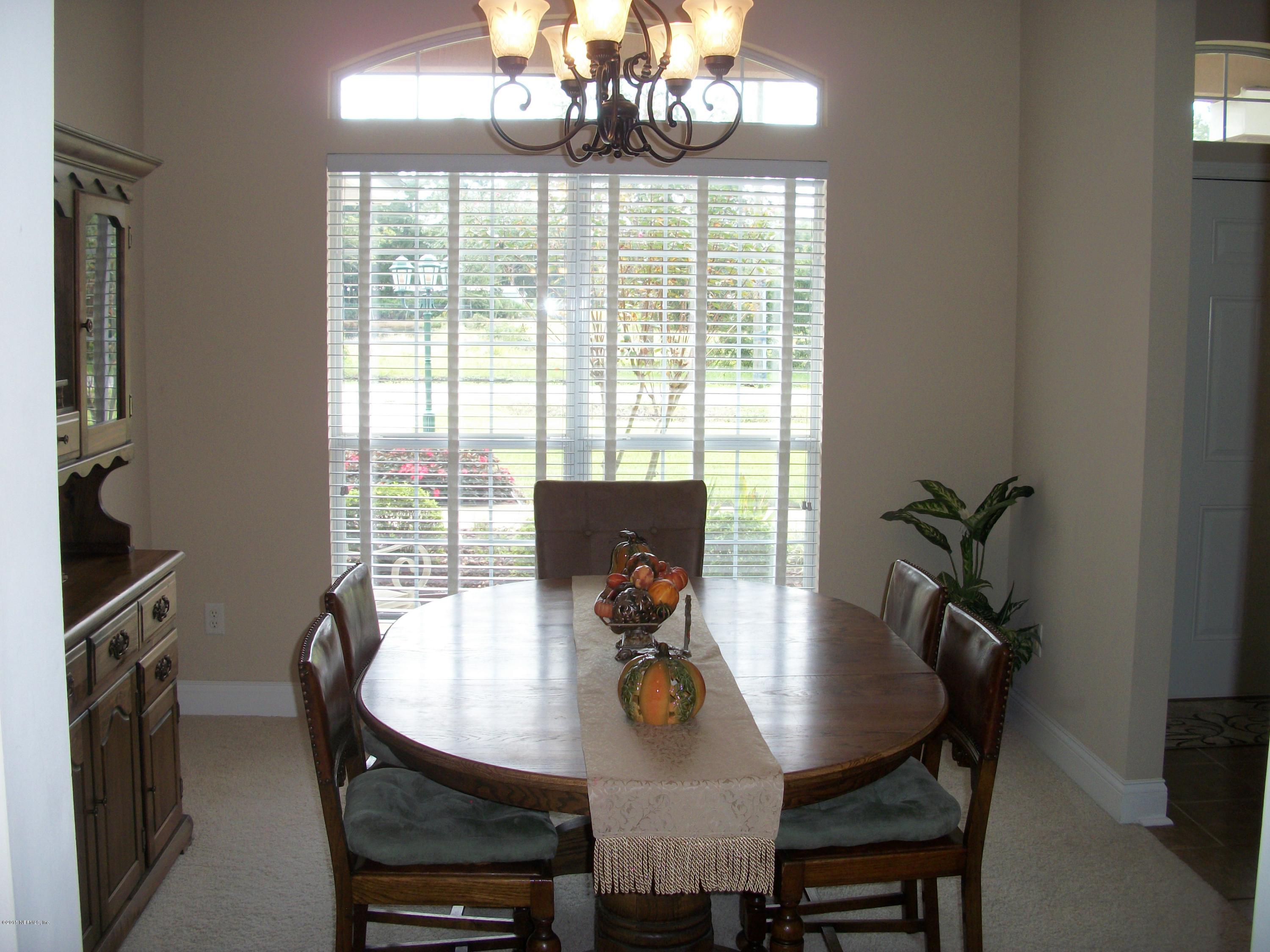 96057 Maranatha Road Yulee, FL 32097 - Photo 6 of 25 a view of a dining room with furniture window and outside view