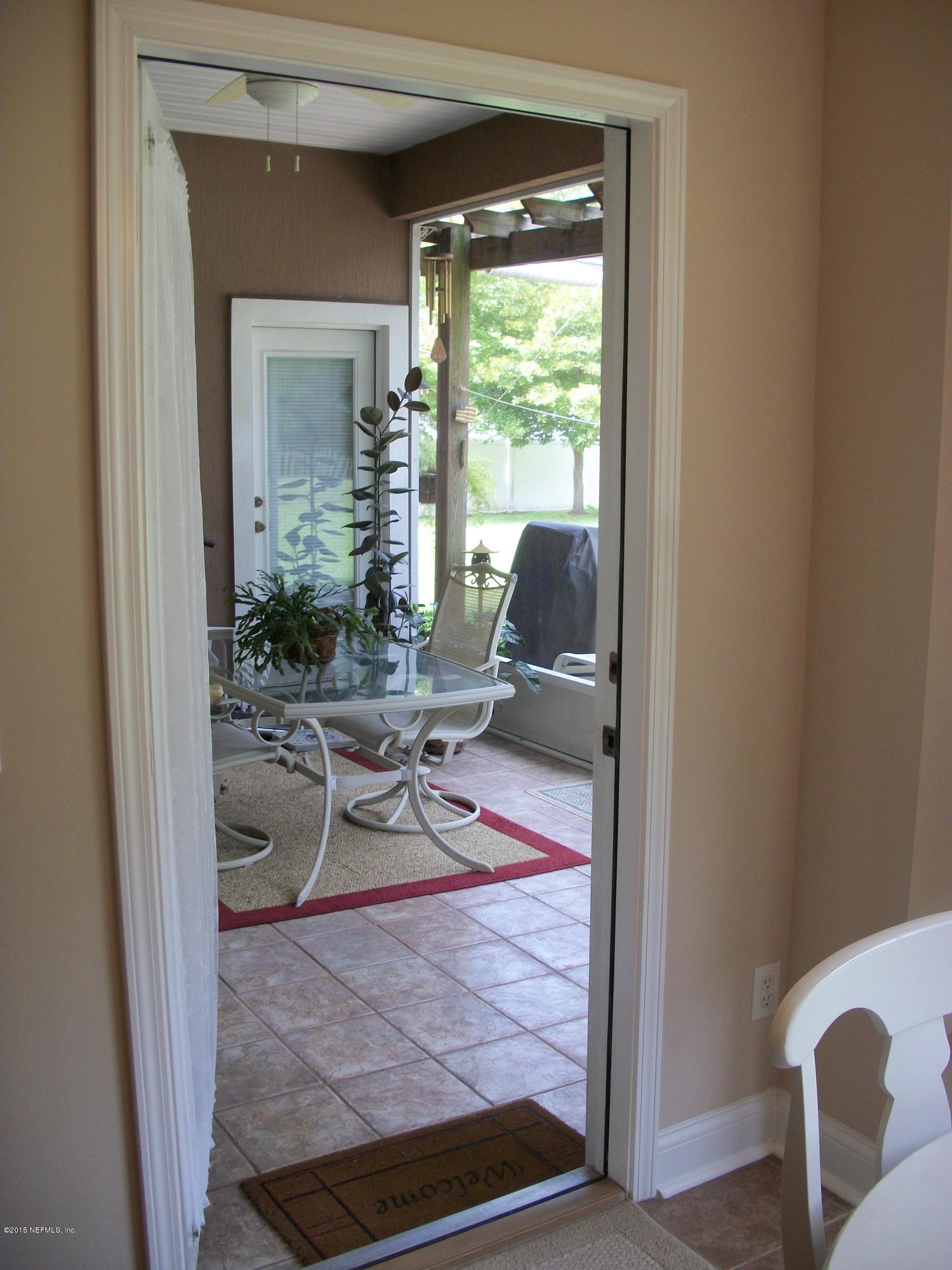 96057 Maranatha Road Yulee, FL 32097 - Photo 10 of 25 a view of a workspace with furniture and a window