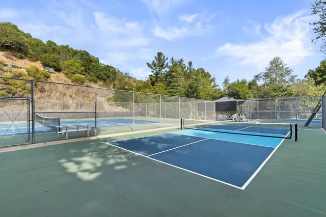 a view of a swimming pool with a yard