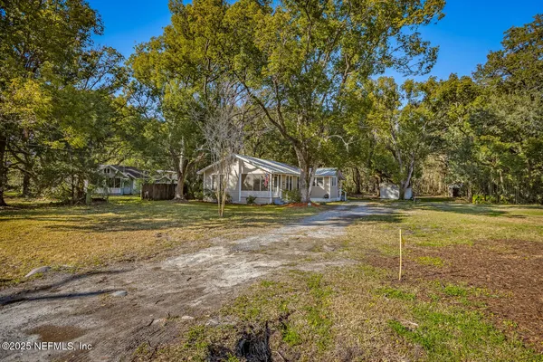 a view of outdoor space with trees all around