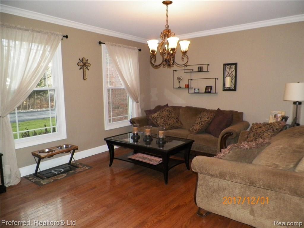 6595 Weed Road Plymouth, MI 48170 - Photo 14 of 42 Hardwood floored Living Room!