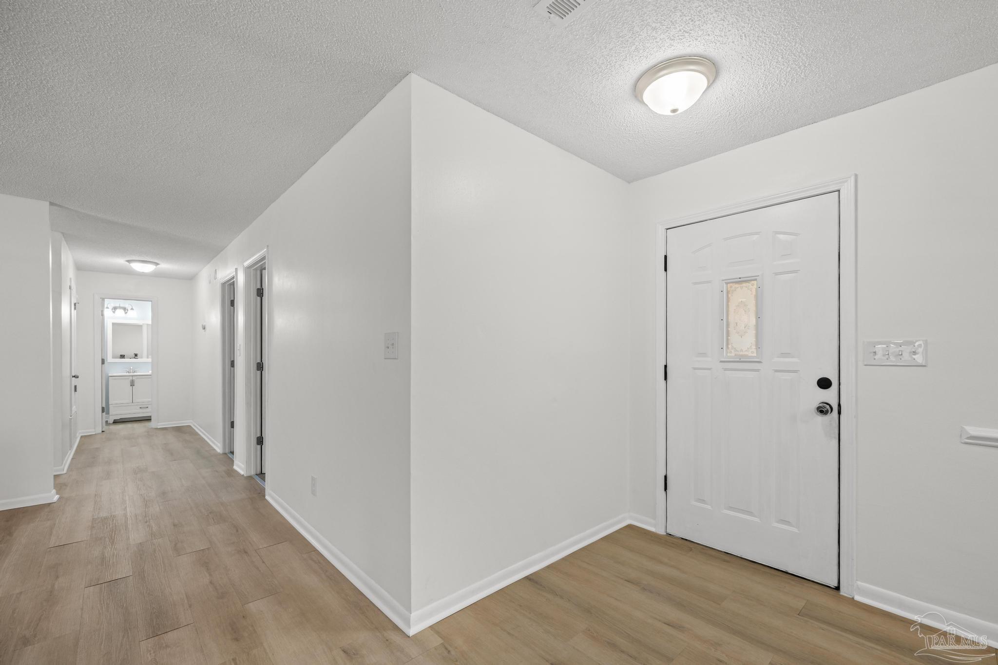 1747 New Hope Road Gulf Breeze, FL 32563 - Photo 20 of 52 looking down hallway toward bedrooms
