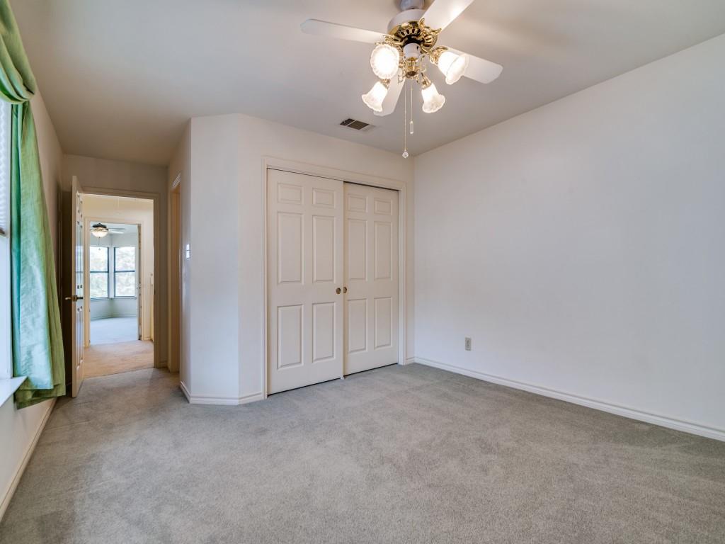 9959 Waterfront Trail Rowlett, TX 75087 - Photo 15 of 26 Unfurnished bedroom featuring light colored carpet, a closet, and a ceiling fan