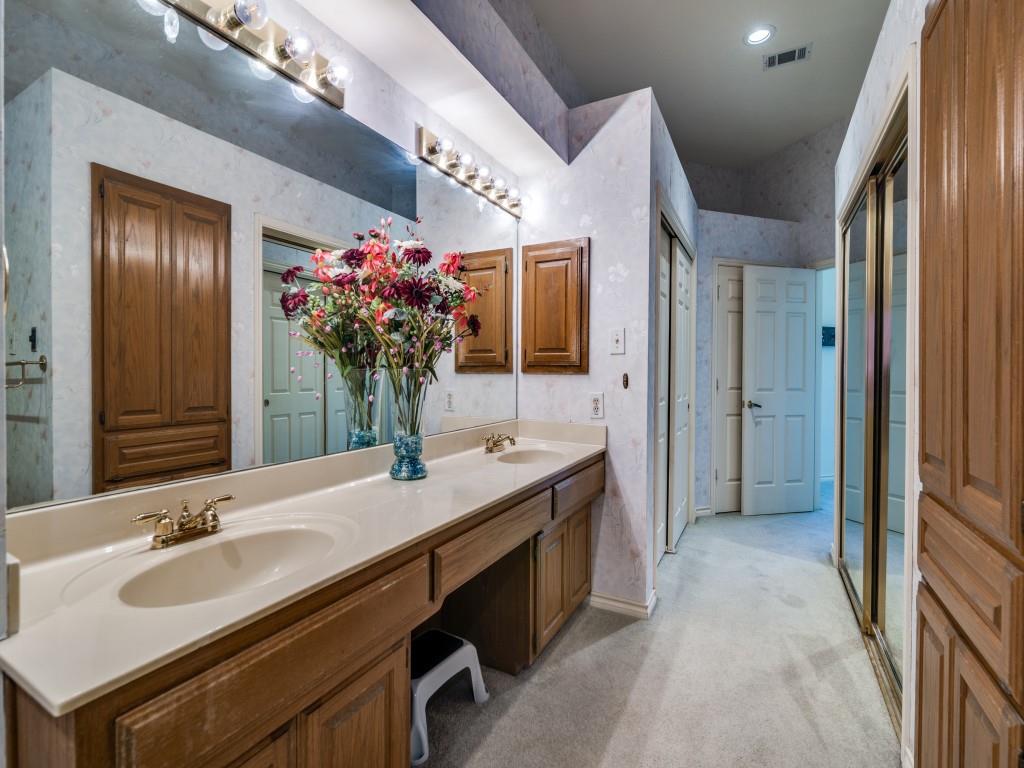 9959 Waterfront Trail Rowlett, TX 75087 - Photo 20 of 26 a bathroom with a sink double vanity granite and a mirror