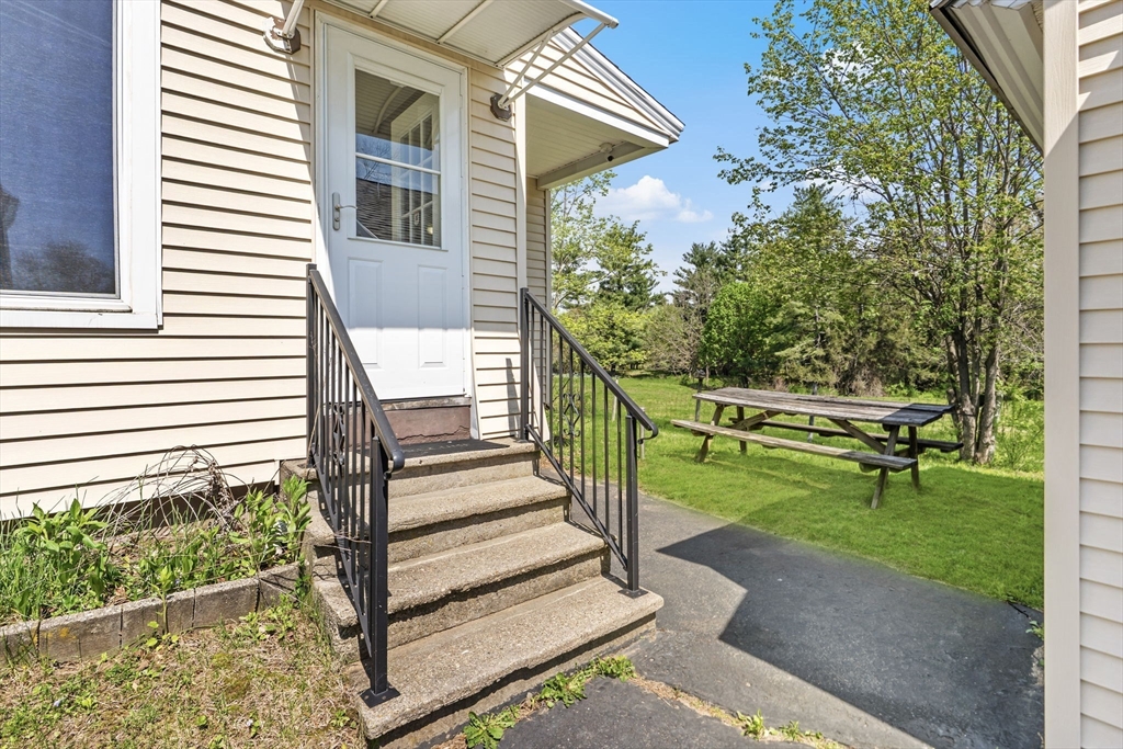 17 Moose Brook Road Southampton, MA 01073 - Photo 4 of 38 a view of a house with a small yard and wooden fence