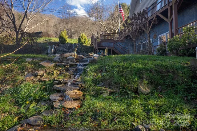 a backyard of a house with lots of green space