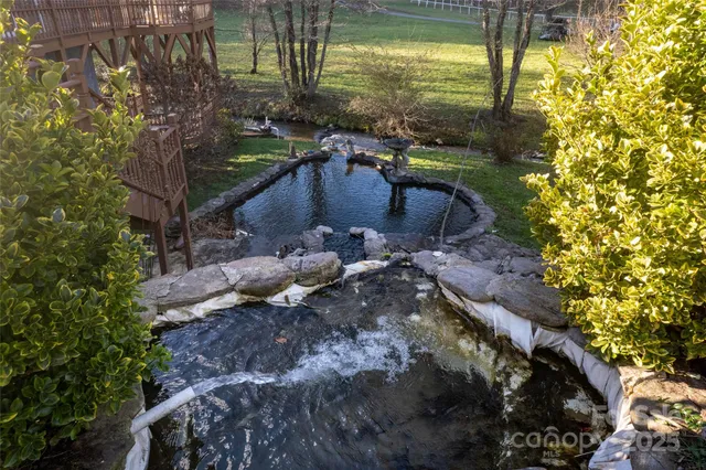 a view of swimming pool from a lake view