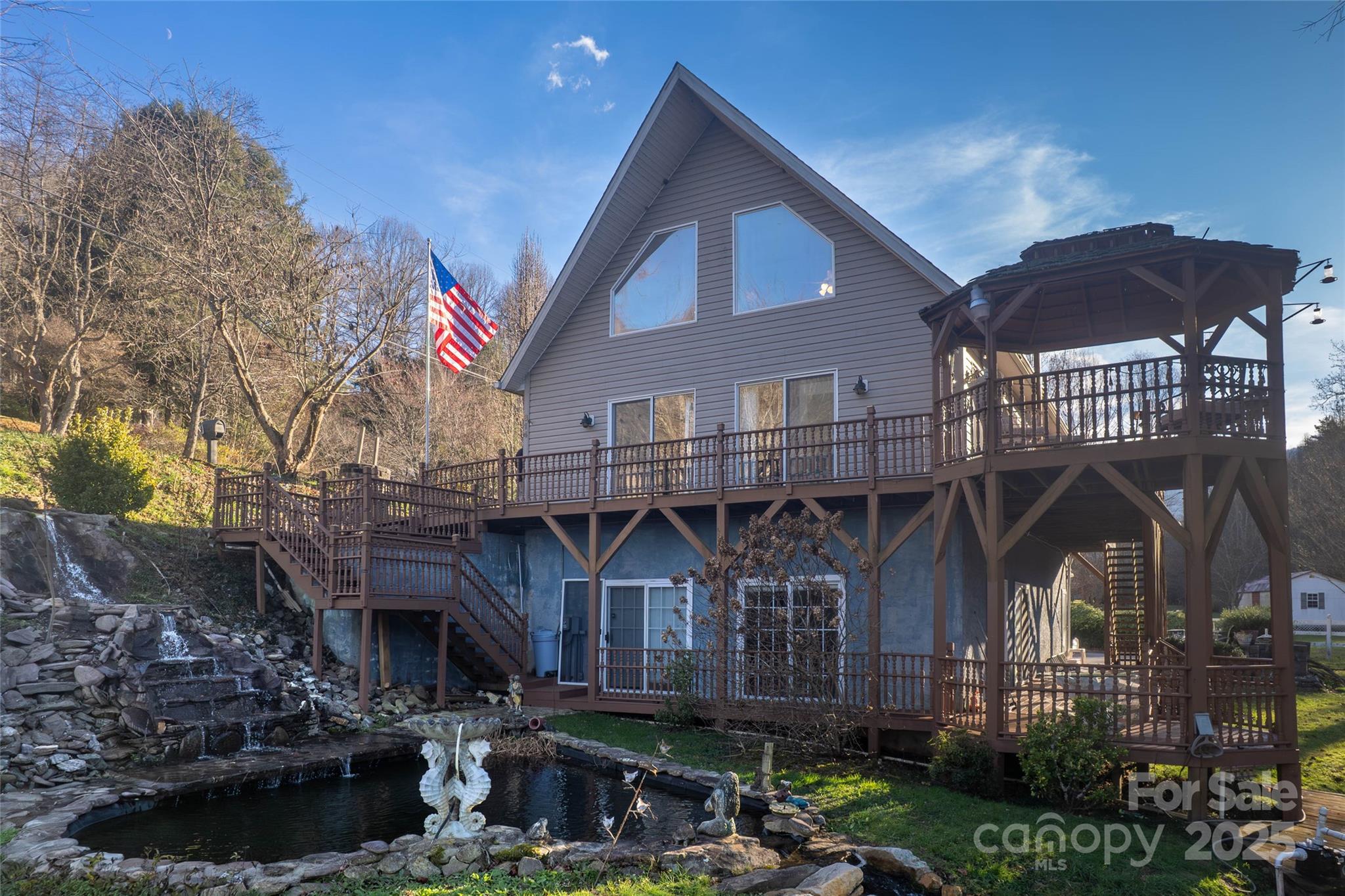 814 Barkers Creek Road Whittier, NC 28789 - Photo 18 of 40 a front view of a house with yard and parking