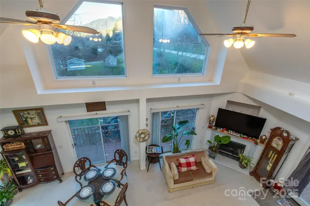 a living room with fireplace furniture and a flat screen tv