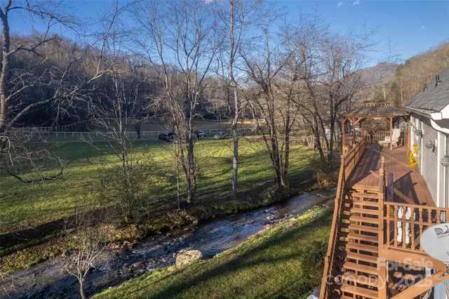 a backyard of a house with lots of green space
