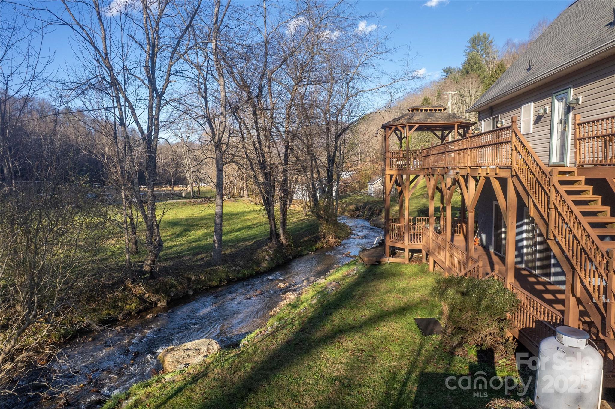 814 Barkers Creek Road Whittier, NC 28789 - Photo 9 of 40 a backyard of a house with lots of green space