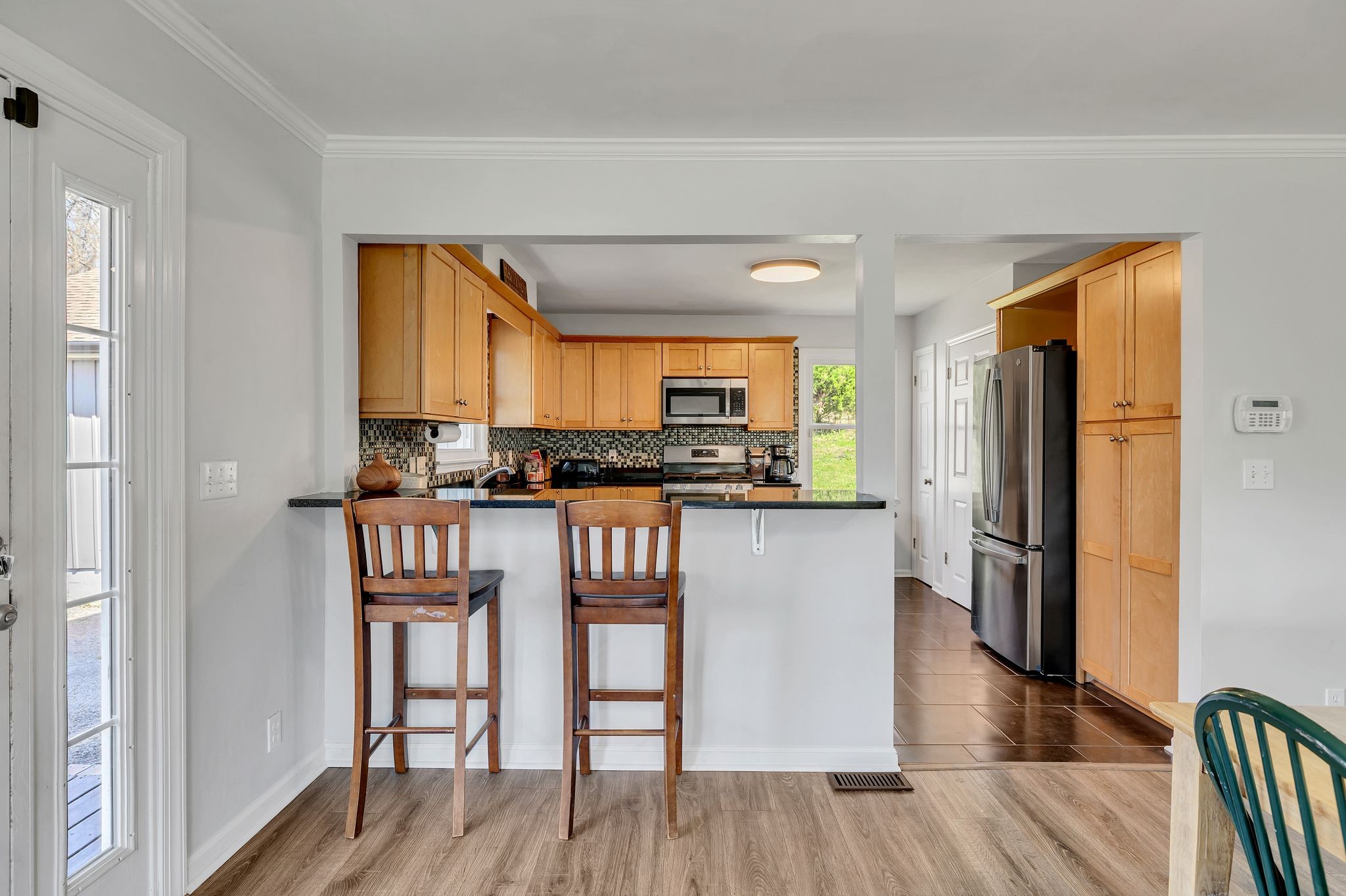 1830 Popes Chapel Road Thompson's Station, TN 37179 - Photo 16 of 53 a kitchen with stainless steel appliances a refrigerator and wooden floor