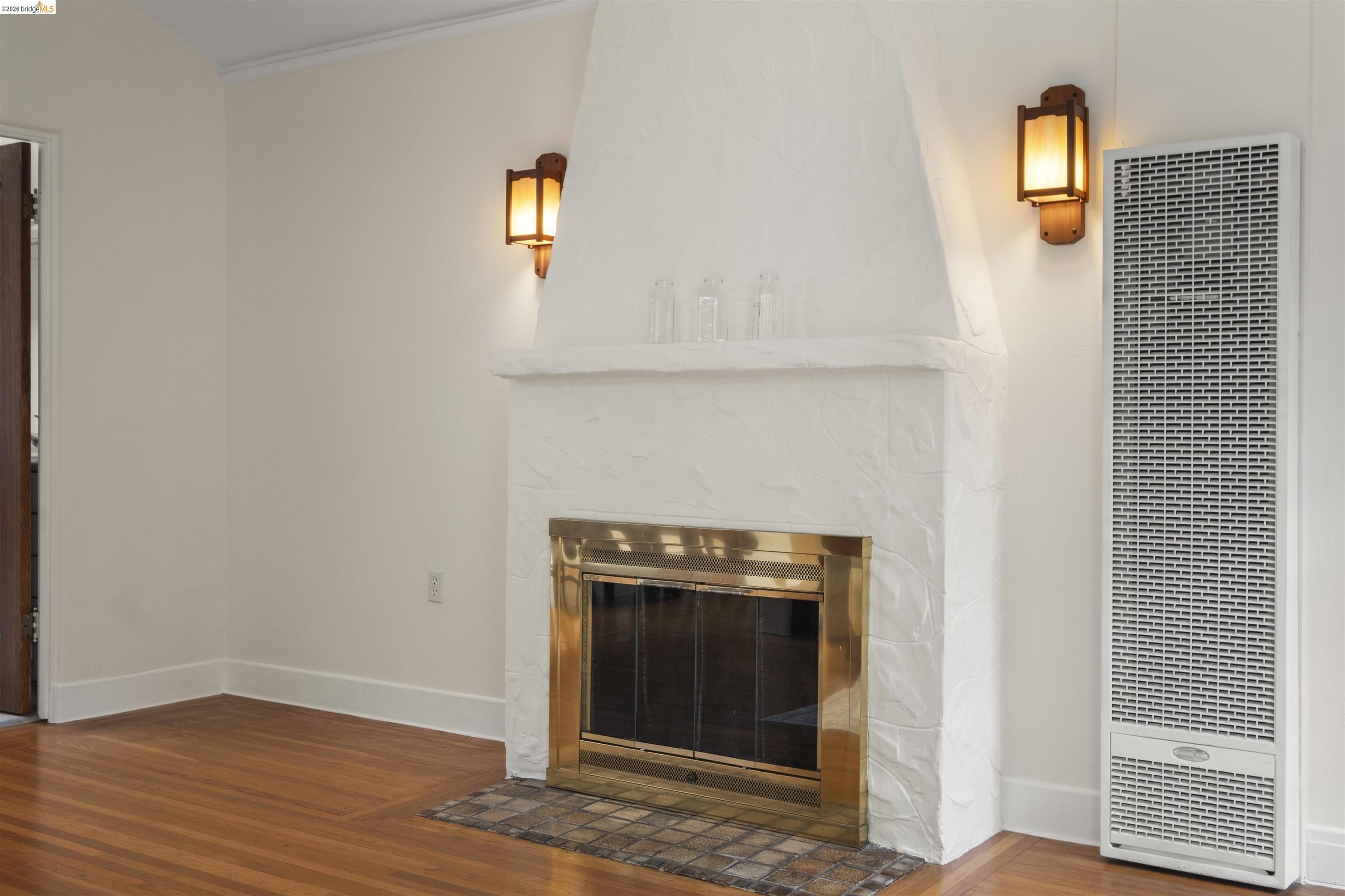 2444 Virginia Street, Unit B Berkeley, CA 94709 - Photo 13 of 39 Fireplace featuring a brass-framed firebox and a brick hearth