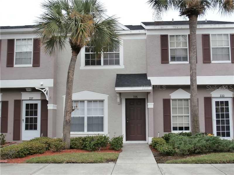 335 Countryside Key Boulevard Oldsmar, FL 34677 - Photo 1 of 1 a front view of a house with a garden