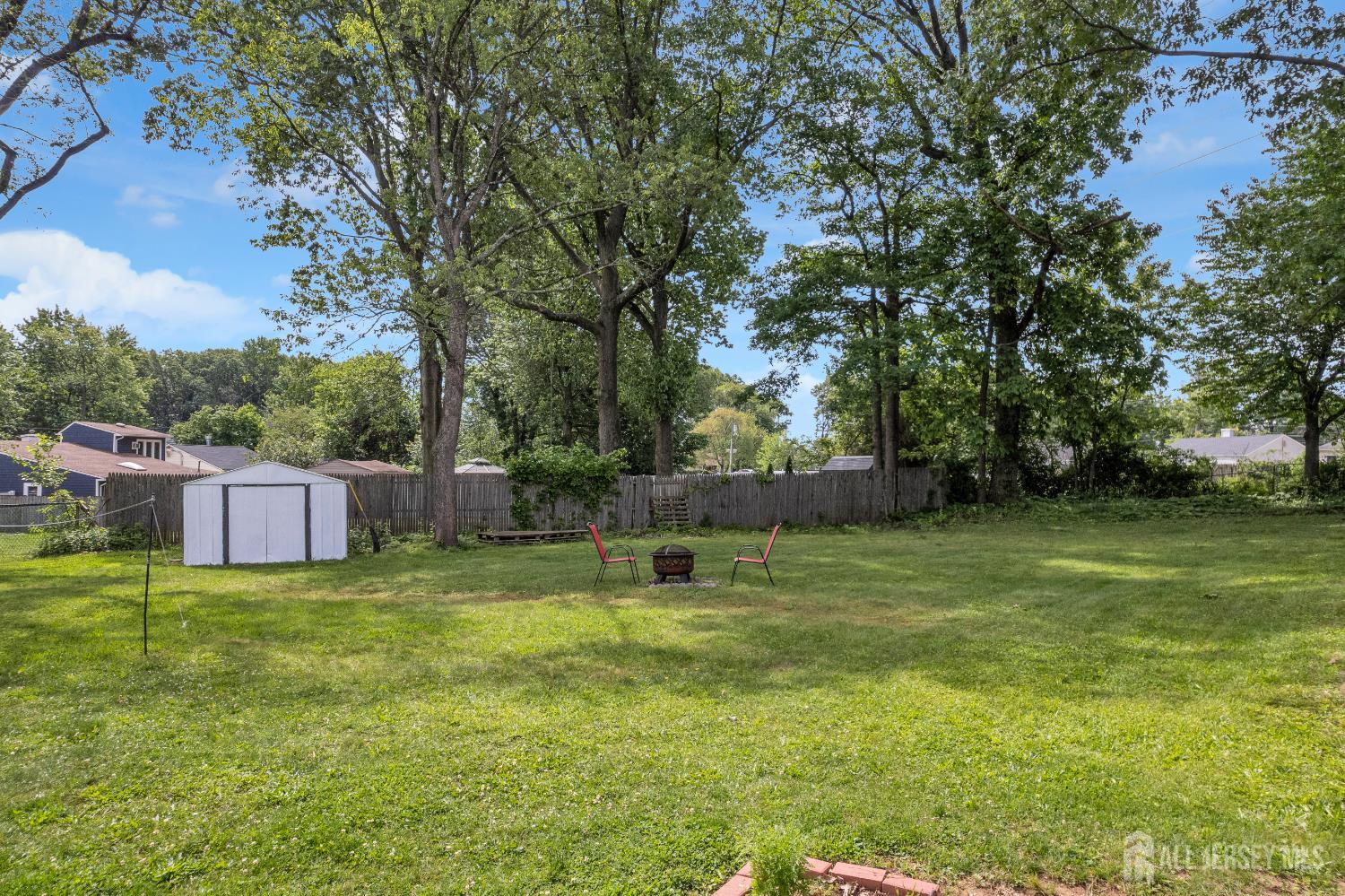 4 Dayton Road Edison, NJ 08817 - Photo 11 of 14 a swimming pool with wooden fence