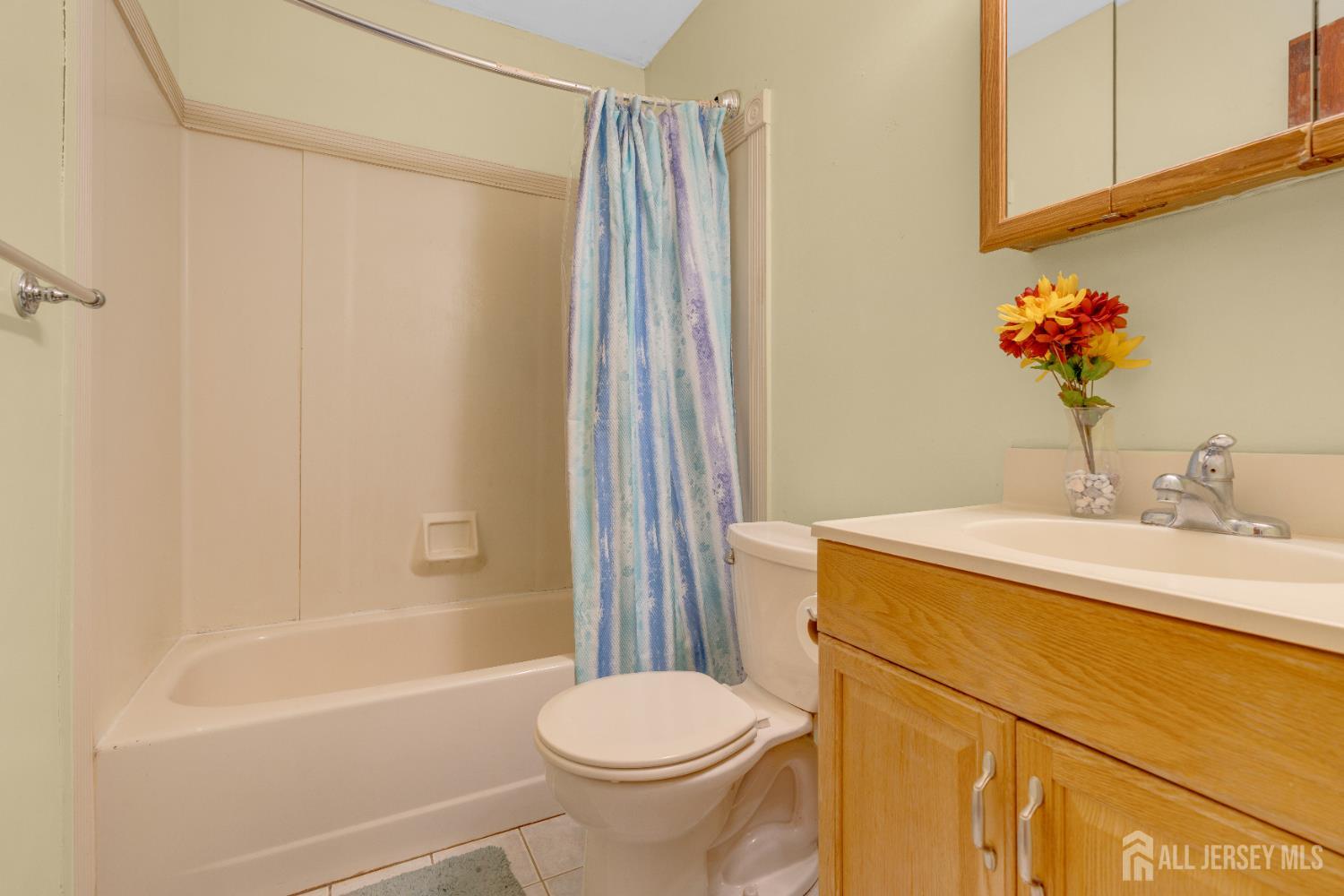 4 Dayton Road Edison, NJ 08817 - Photo 5 of 14 a bathroom with a sink toilet and shower
