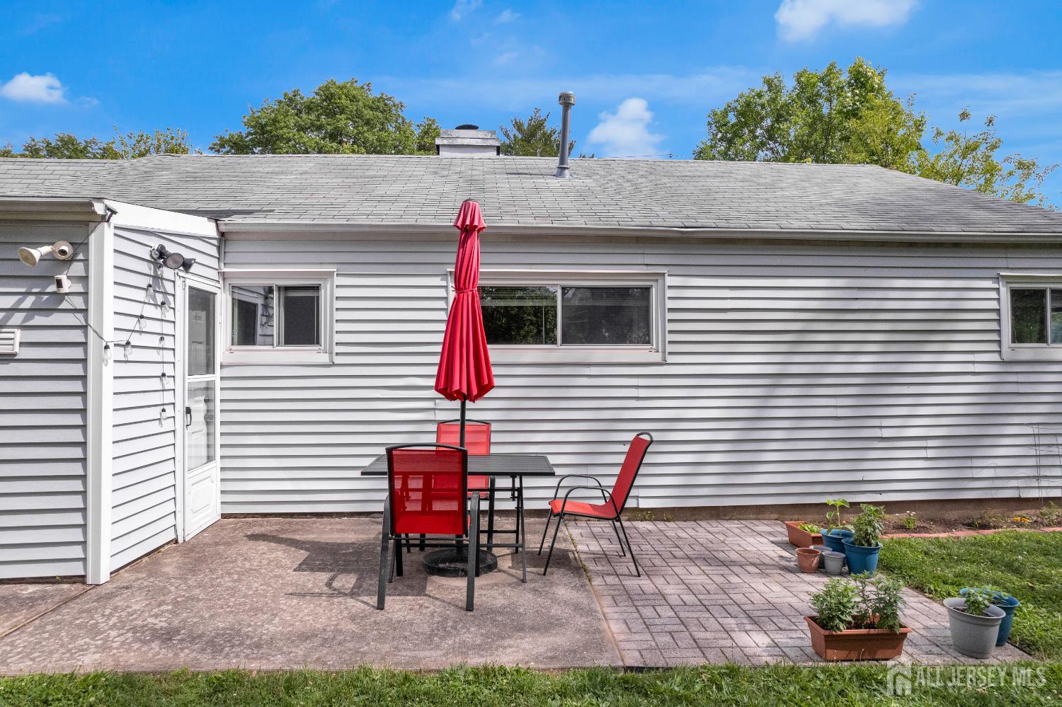 4 Dayton Road Edison, NJ 08817 - Photo 9 of 14 a backyard of a house with table and chairs