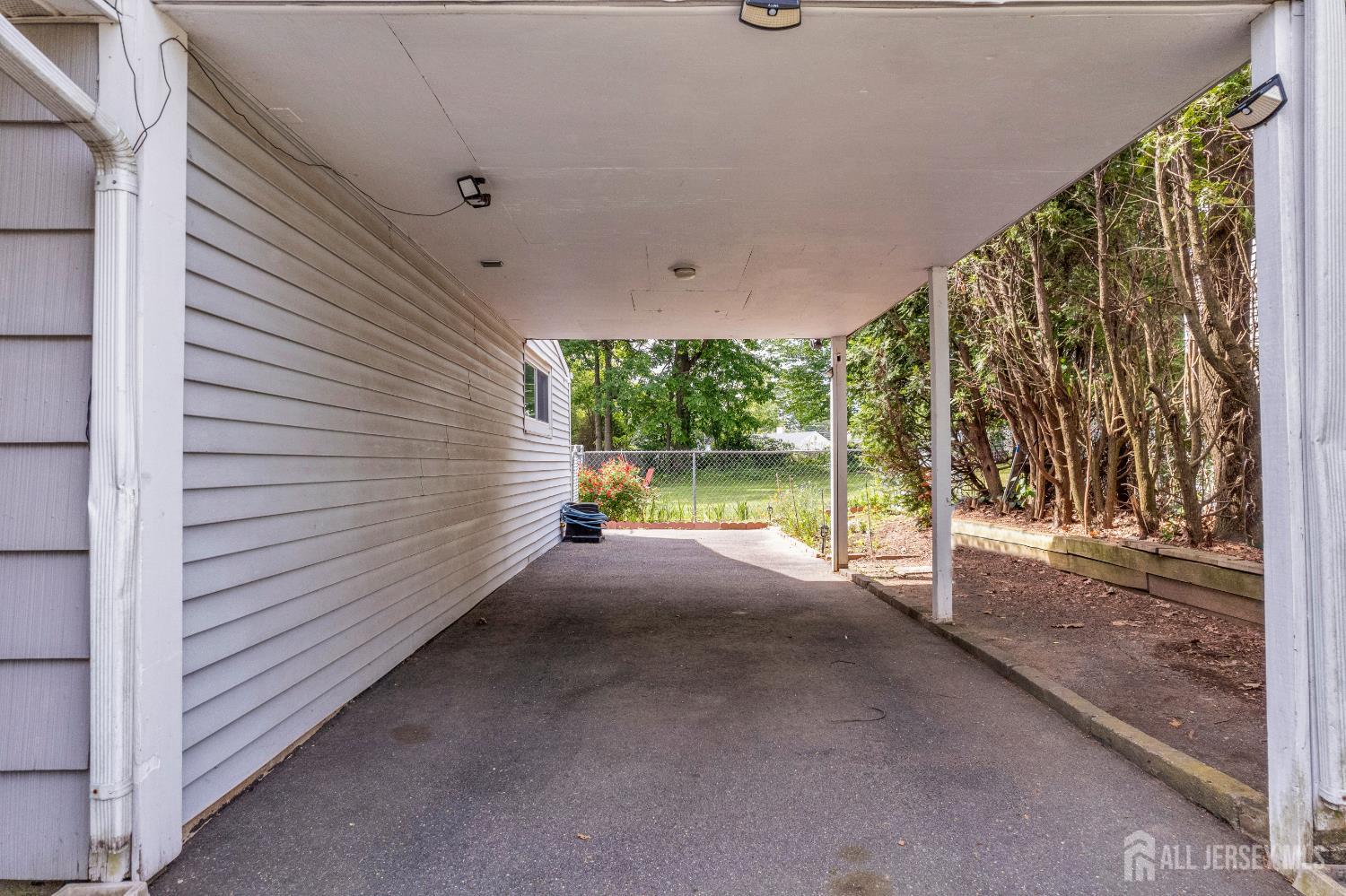 4 Dayton Road Edison, NJ 08817 - Photo 10 of 14 a view of a house with a yard and garage