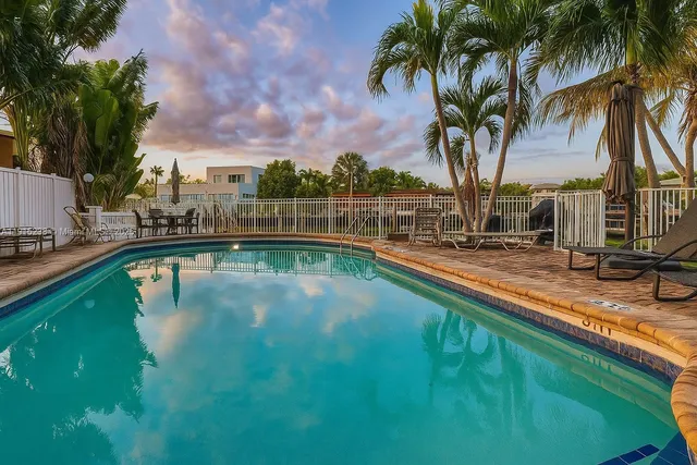 a view of a swimming pool with a lake view