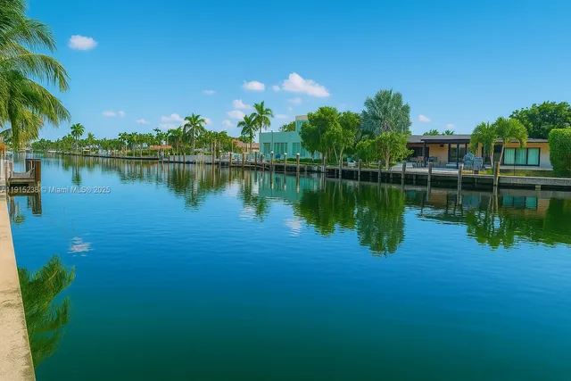 a view of a lake with a house in the background