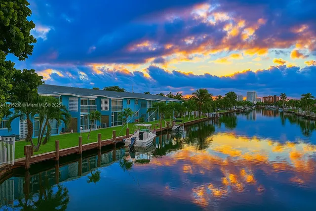 a view of a lake with a house in the background